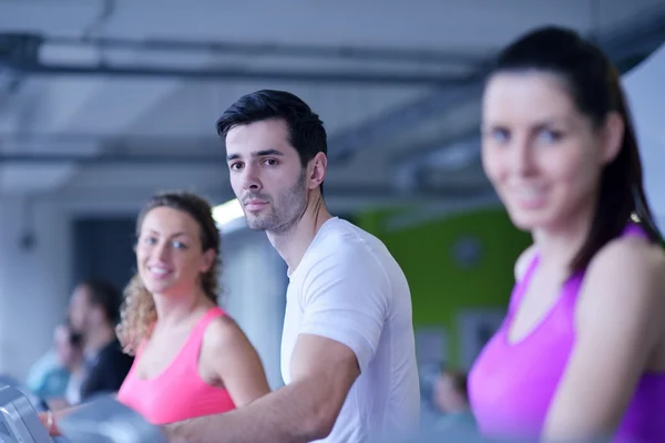 Group of people running on treadmills — Stock Photo, Image