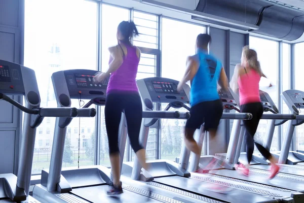 People running on treadmills — Stock Photo, Image