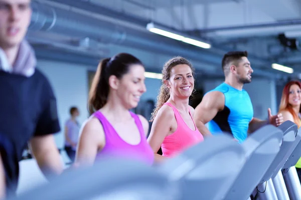 Group of people running on treadmills Royalty Free Stock Photos