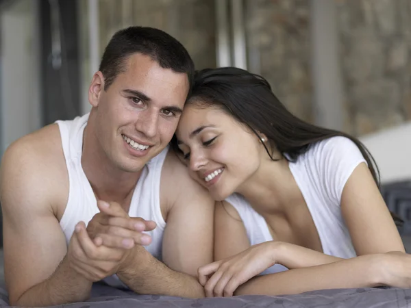 Couple relax and have fun in bed Stock Photo