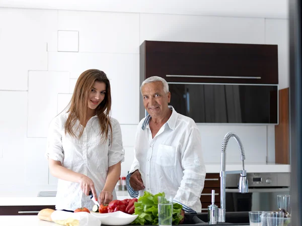 Man and woman at kitchen — Stock Photo, Image