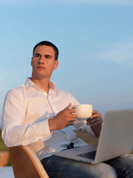 Relaxed young man at home balcony — Stock Photo, Image