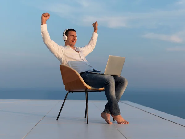 Relaxed young man at home balcony — Stock Photo, Image