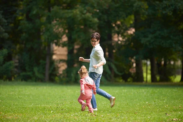 Happy family together outdoor in park — Stock Photo, Image