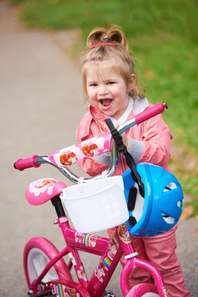 Little girl with bicycle Royalty Free Stock Photos