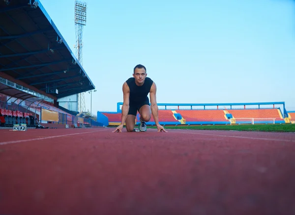 Sprinter leaving starting blocks — Stock Photo, Image