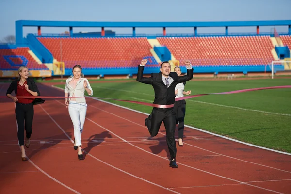 Business people running on racing track — Stock Photo, Image