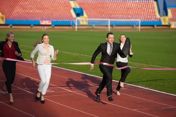 Business people running on racing track — Stock Photo, Image