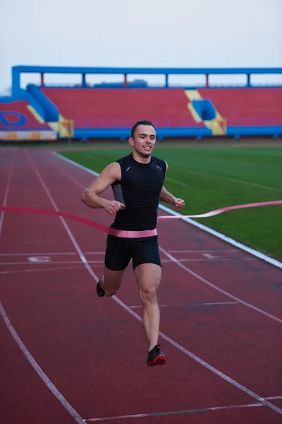 Atletische loper finis lijn nummer — Stockfoto