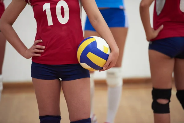 Girls playing volleyball indoor — Stock Photo, Image