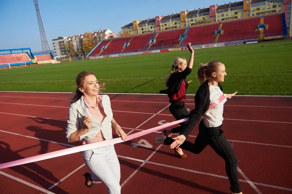 business people running on racing track