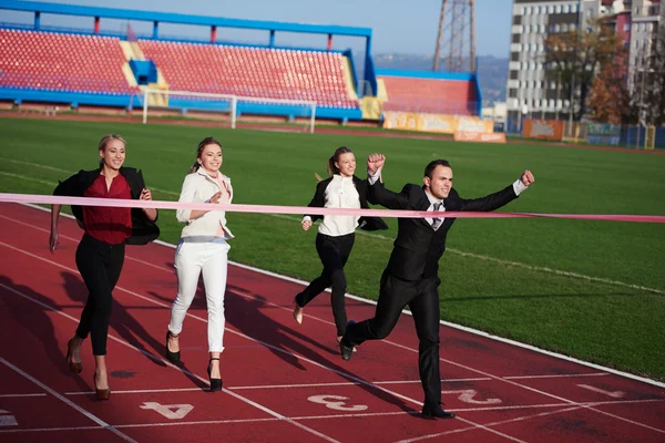 Business people running on racing track — Stock Photo, Image