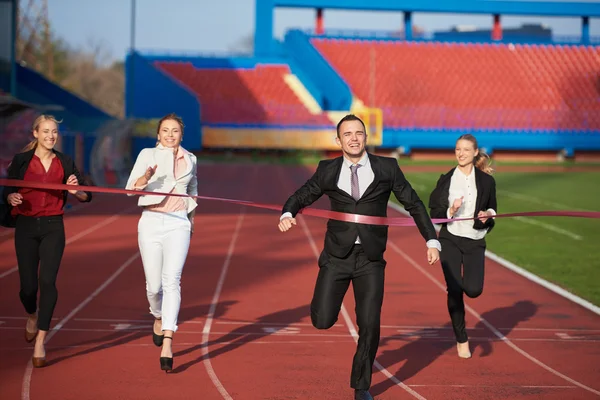 Gente de negocios corriendo en pista de carreras — Foto de Stock