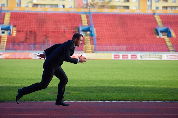 Businessman ready to sprint — Stock Photo, Image