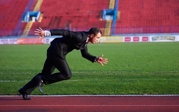 Businessman ready to sprint — Stock Photo, Image