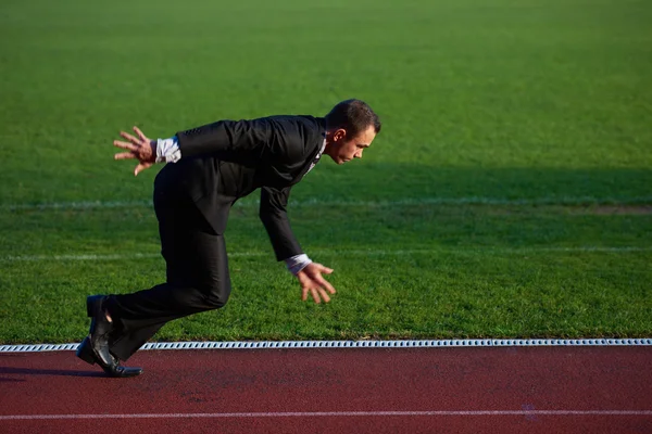 Businessman ready to sprint — Stock Photo, Image