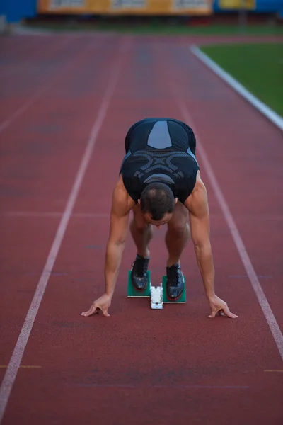 Jonge atletische loper — Stockfoto