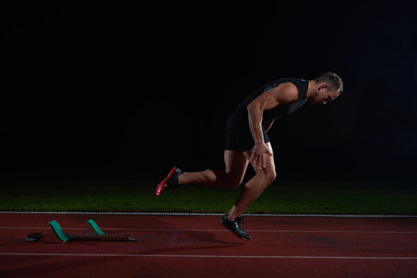 Sprinter leaving starting blocks