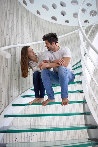 Relaxed young couple at home  stairs — Stock Photo, Image