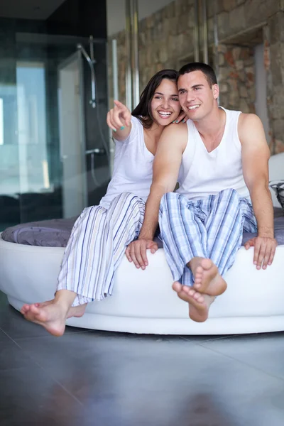 Couple relaxing and having fun in bed — Stock Photo, Image