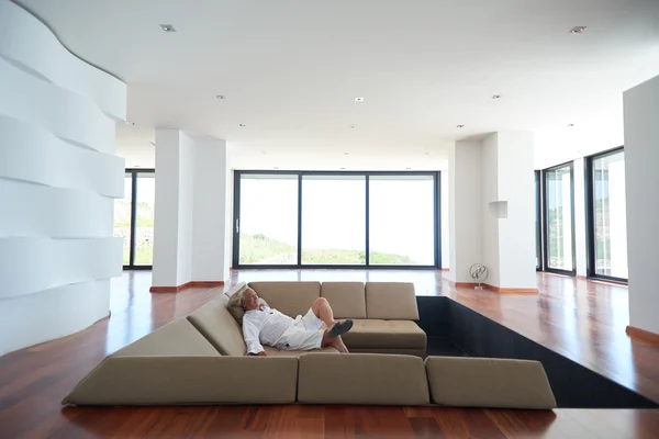 Senior man relaxing in sofa — Stock Photo, Image