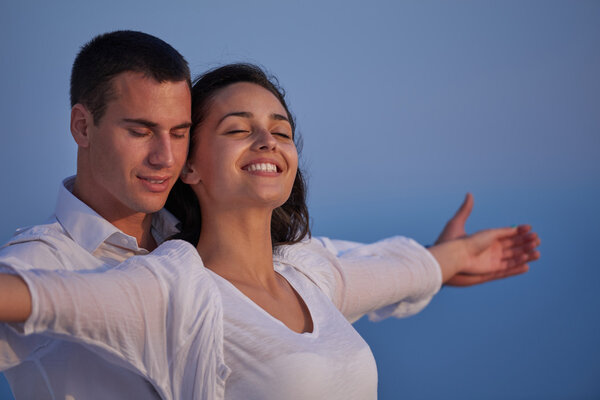 couple relaxing at modern home outdoor terrace