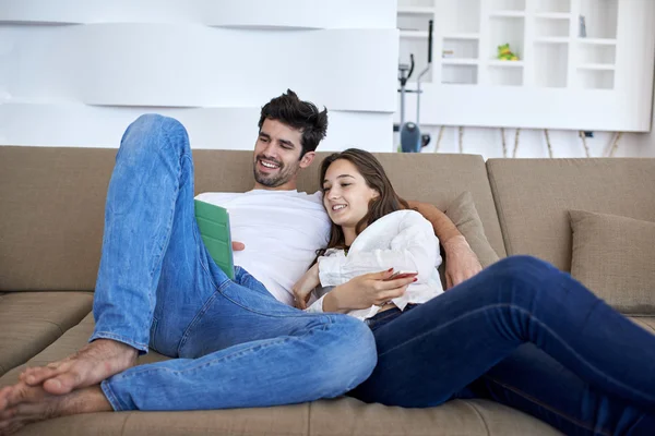Couple at modern home using tablet computer — Stock Photo, Image
