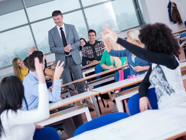 Students with teacher in classroom — Stock Photo, Image