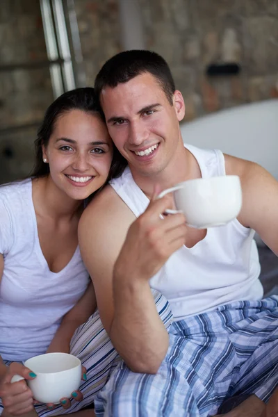 Couple relaxing and having fun in bed — Stock Photo, Image