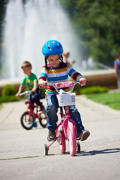 Happy boy learning to ride his first bike — Stock Photo, Image