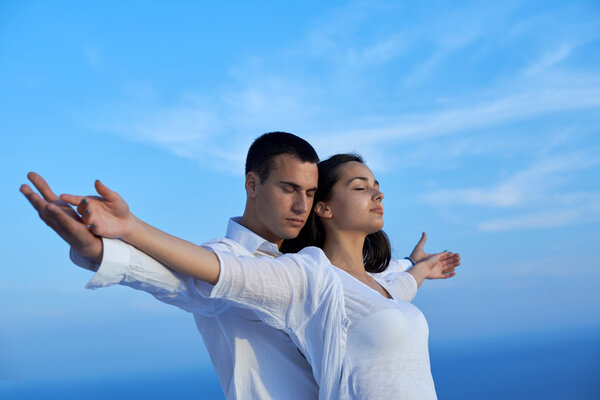 Happy young romantic couple at balcony