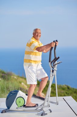 Healthy senior man working out clipart
