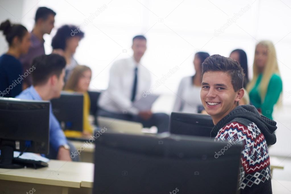 students with teacher in computer classroom