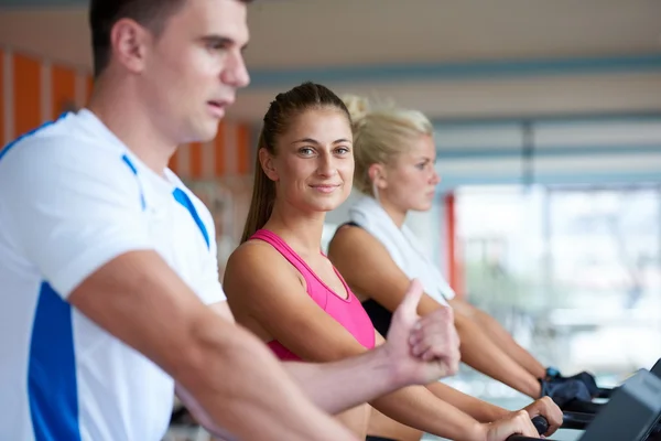 Friends  exercising on a treadmill — Stock Photo, Image