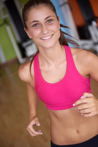 Woman exercising on treadmill — Stock Photo, Image