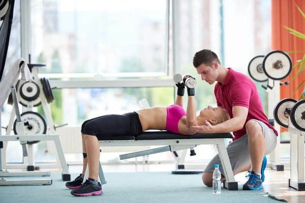 Young sporty woman with trainer — Stock Photo, Image