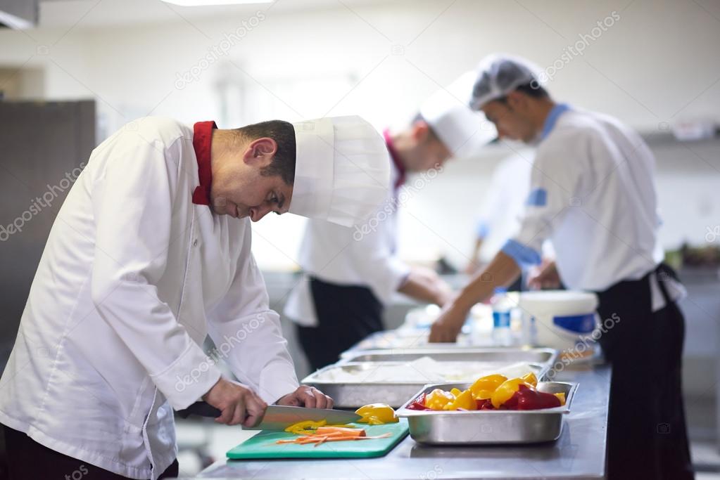 chef slicing vegetables with knife