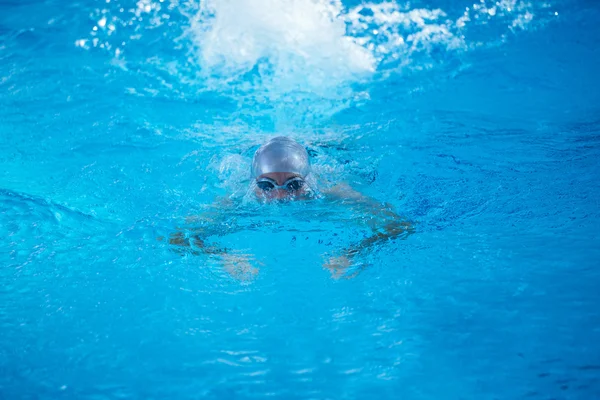 Swimmer in indoor swimming pool — Stock Photo, Image