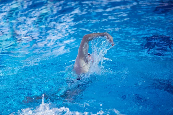 Swimmer in indoor swimming pool, — Stock Photo, Image