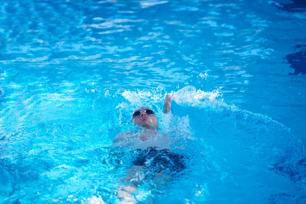 Swimmer in indoor swimming pool — Stock Photo, Image
