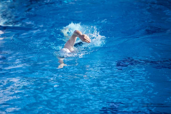 Swimmer in indoor swimming pool — Stock Photo, Image