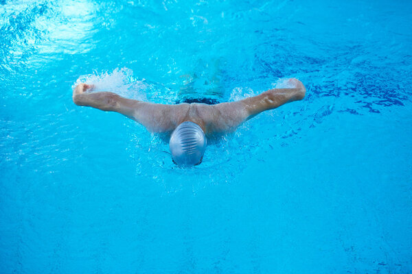 swimmer in indoor swimming pool