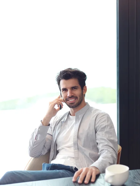 Relaxed young man and first morning coffee — Stock Photo, Image