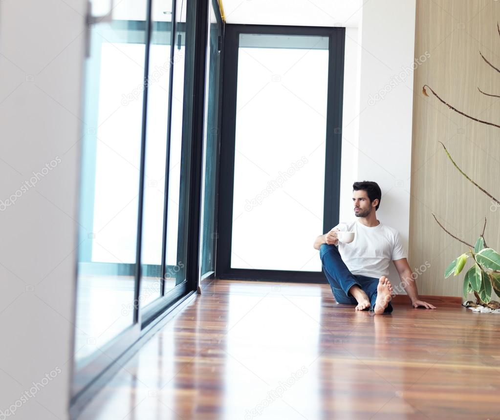 man drinking first morning coffee