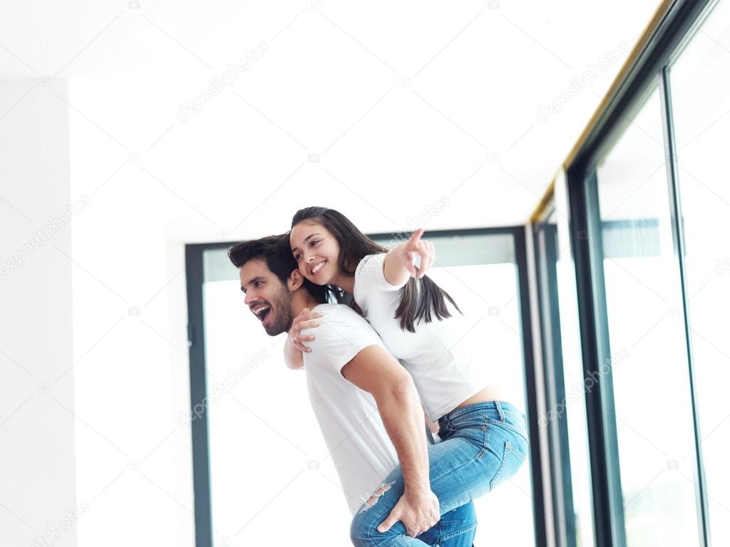 happy young romantic couple indoors