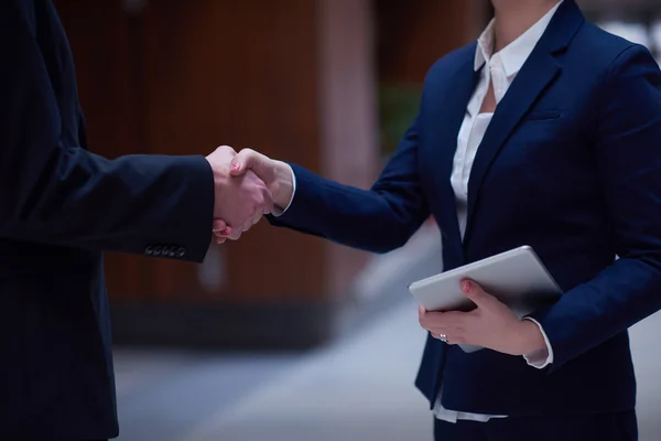 business man and woman hand shake