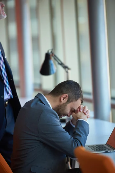 Frustrated young business man at office — Stock Photo, Image