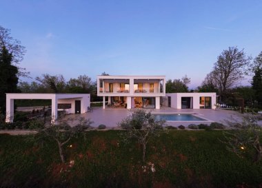 Modern lüks villa geceleri havuz, teraslar ve modern mimari ile aydınlatılıyor. Sıcak ışıklandırma ve zarif açık hava yaşamı şık ve sofistike bir atmosfer yaratır..