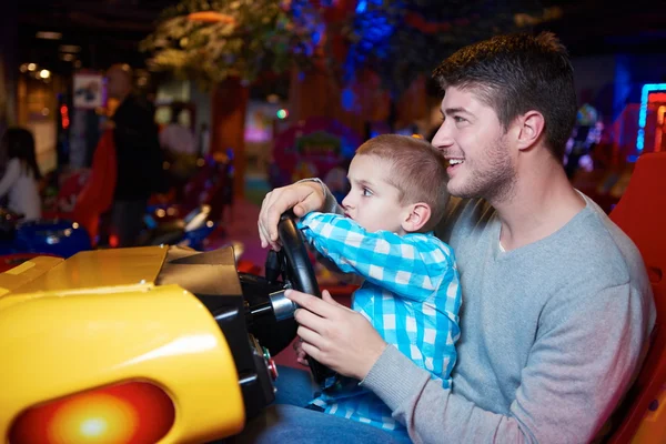 Father and son playing game in playground — Stock Photo, Image