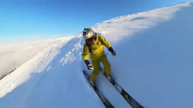 An adventurous skier carves through pristine deep powder snow, enjoying the exhilaration of off-piste heliskiing. Experience the freedom and breathtaking beauty of winter mountain sports under a